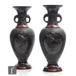 A pair of Chinese bronze vases, late Qing Dynasty (1644-1912), each of baluster form, rising from