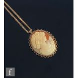 A 9ct hallmarked cameo pendant/brooch depicting profile of a classical maiden, suspended from a