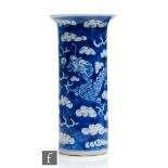 A Chinese 19th to 20th Century small blue and white sleeve vase, decorated with dragon in pursuit of