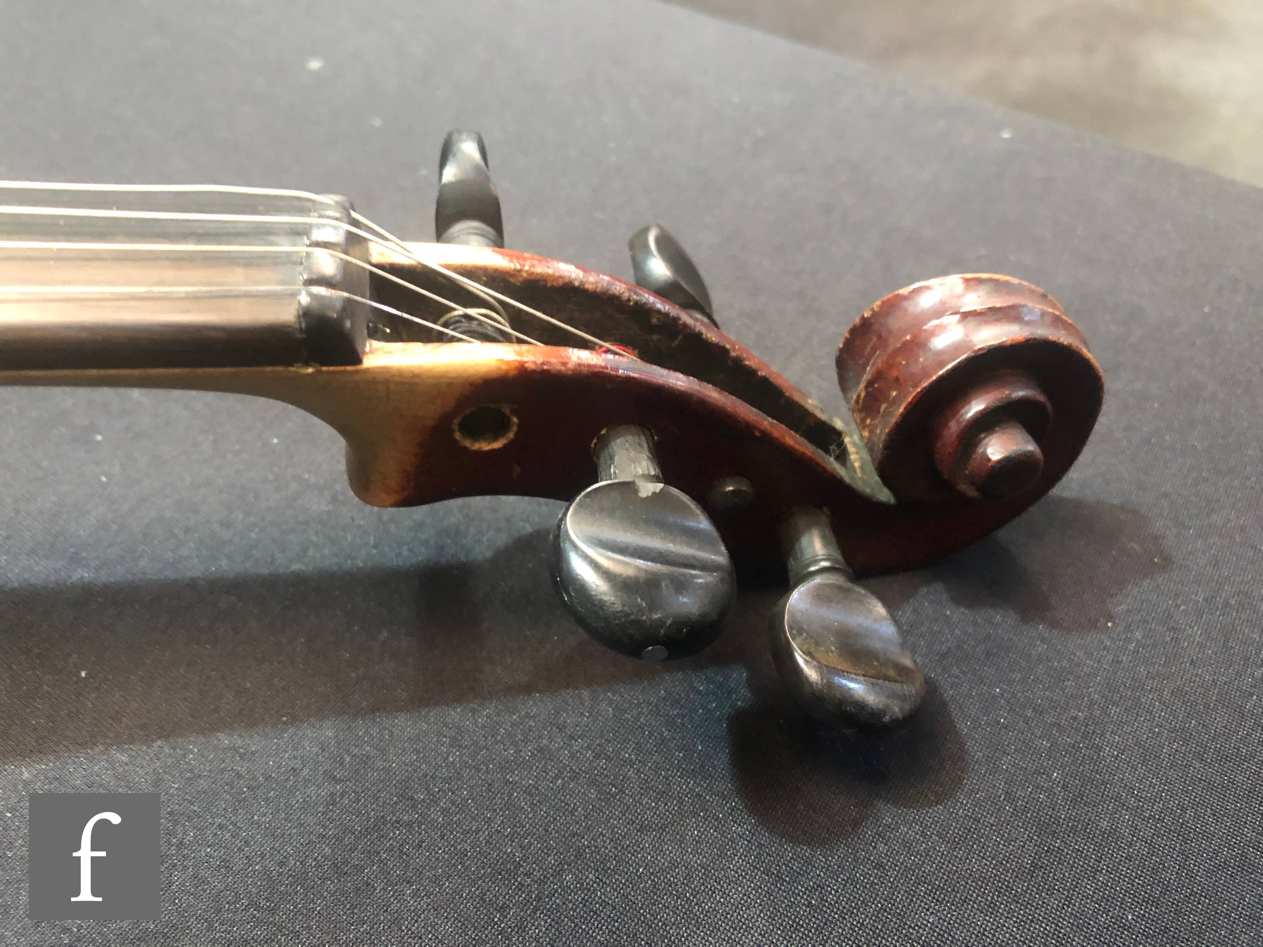 A late 19th Century German violin, length 36cm, and a bow, in later black zip case. - Image 3 of 16