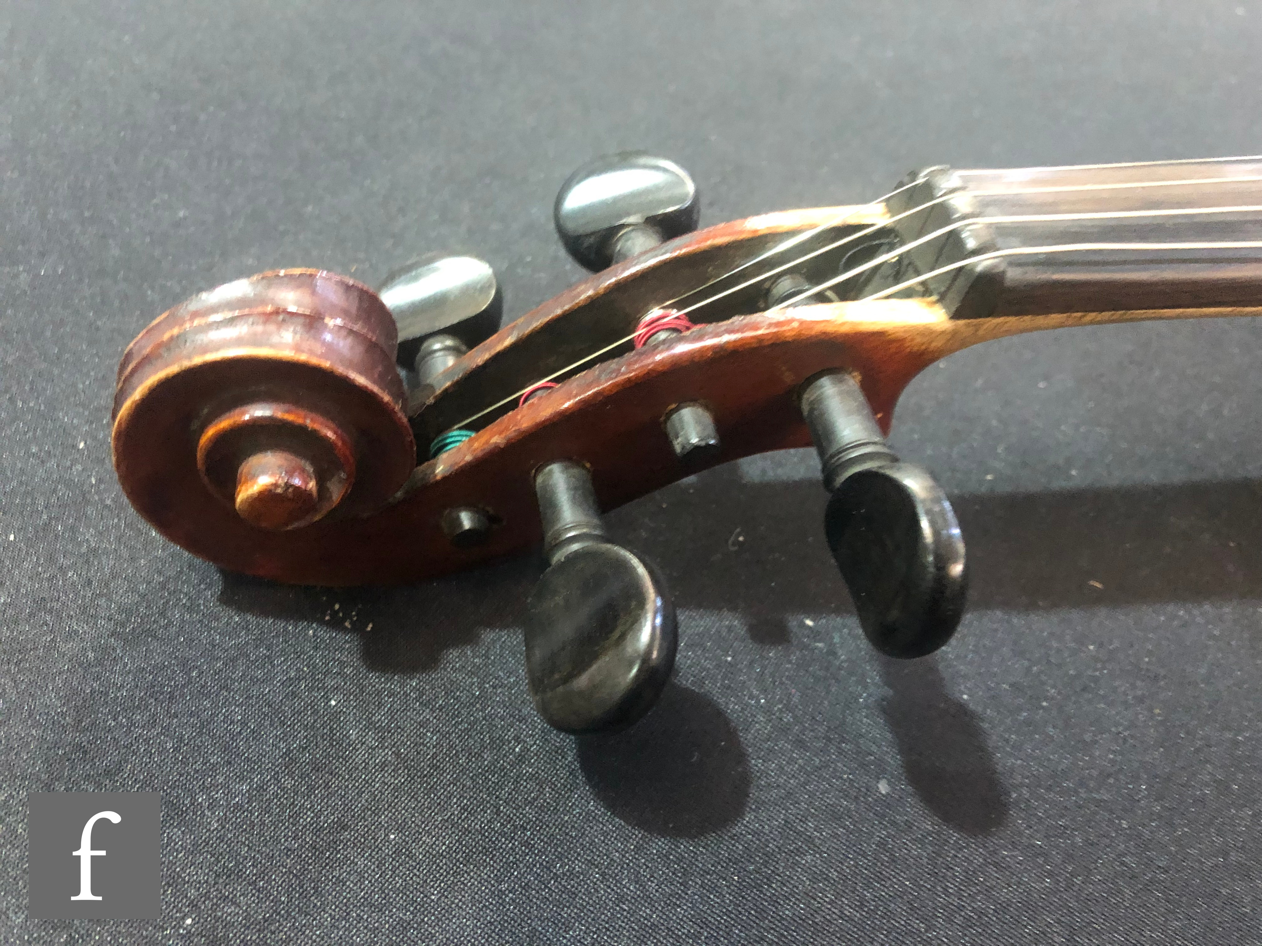 A late 19th Century German violin, length 36cm, and a bow, in later black zip case. - Image 7 of 16