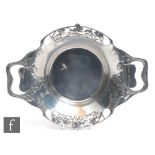 An Arts & Crafts Liberty Tudric pewter dish, designed by Archibald Knox, of circular design with