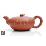 A Chinese Yixing teapot Republic Period (1912-49), of rounded form with branch form handle and