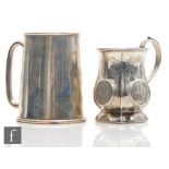 A Victorian hallmarked silver christening tankard with part foliate engraved decoration, with a