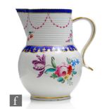 A 19th Century Derby jug decorated with hand painted floral sprays below a blue and gilt collar, the