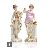 Two 19th Century Dresden type figurines, the first a lady stood draped in robes holding aloft a gilt