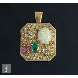 A 9ct hallmarked multi stone canted square pendant detailed with one opal, ruby and emerald to a