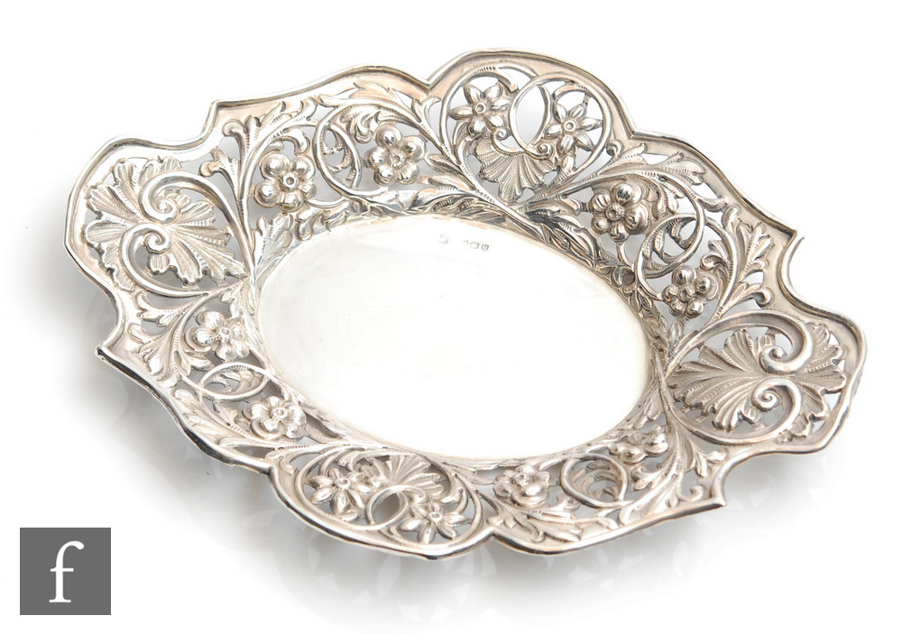 A 19th Century oval shallow dish with pierced foliate decorated borders, weight 5.5oz, length