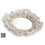 A 19th Century oval shallow dish with pierced foliate decorated borders, weight 5.5oz, length