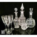 A collection of 19th Century and later crystal glass ware to include three decanters, three