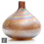 A studio glass onion vase of squat ovoid form with collar neck, decorated with mutlicoloured mottled