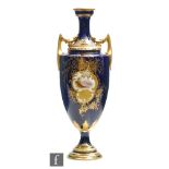 A late 19th Century Coalport pedestal vase decorated with a hand painted cartouche panel within a