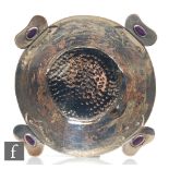 An Arts & Crafts hallmarked silver small bowl with planished decoration to whole terminating in four