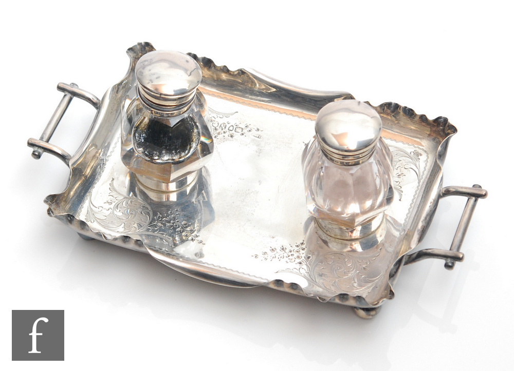 A Victorian hallmarked silver twin handle desk stand of rectangular form with part engraved