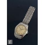 A stainless steel Rolex Oyster precision, manual wrist watch, Arabic numerals to a cream dial,