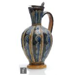 A late 19th Century Doulton Lambeth jug decorated by Eliza Simmance with panels of stylised