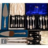A small parcel lot of assorted flatware to include three cased sets of teaspoons, two cased silver