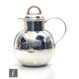 A hallmarked silver Jersey cream jug of plain typical form with wicker bound handle to pull off