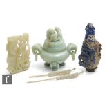 A collection of Chinese late Qing Dynasty (1644-1912) hardstone carvings, to include two green