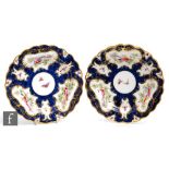 Two early 20th Century Royal Worcester cabinet plates decorated with cartouche panels of fancy birds