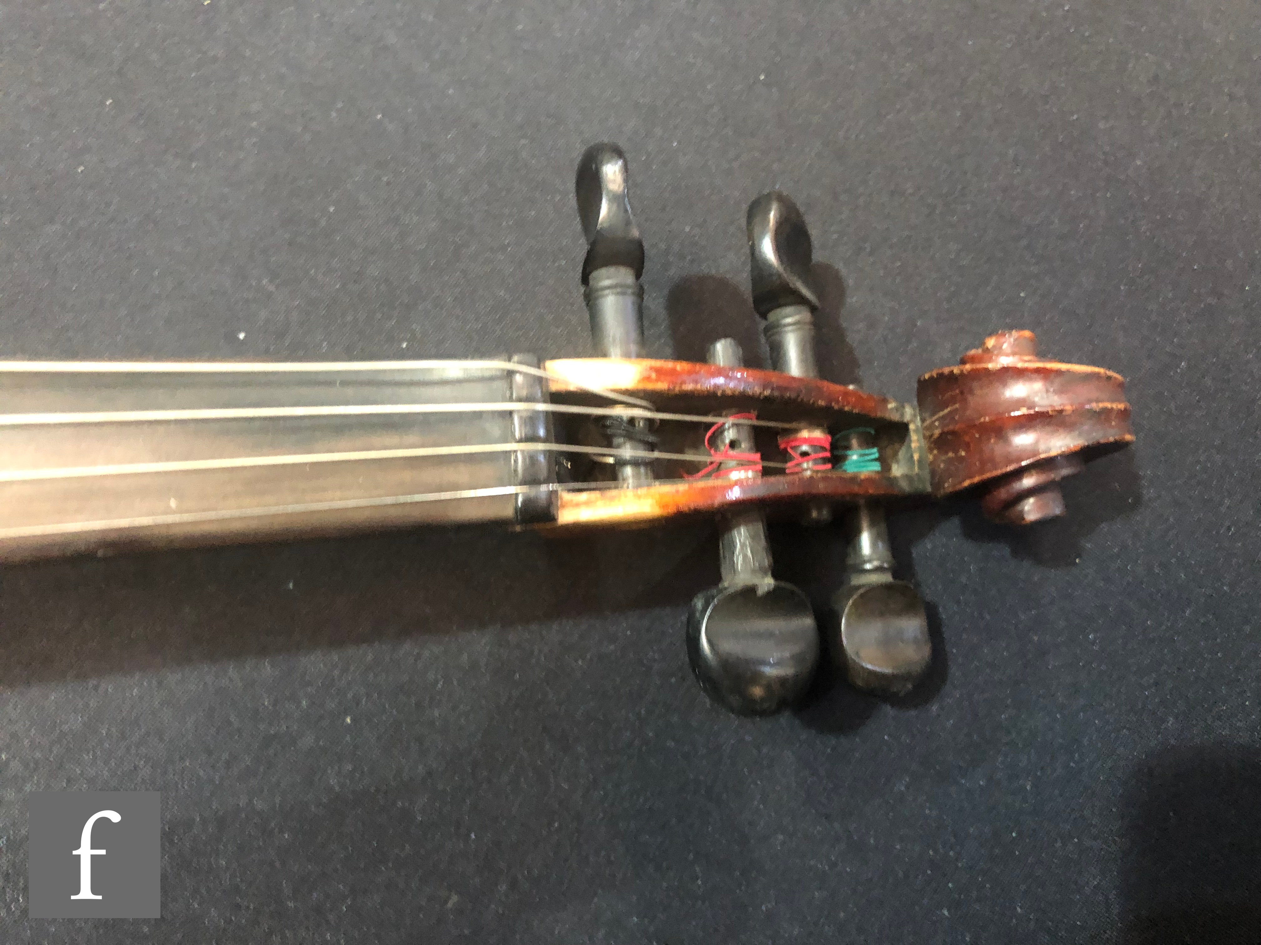 A late 19th Century German violin, length 36cm, and a bow, in later black zip case. - Image 4 of 16