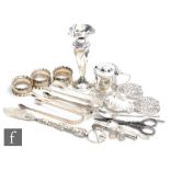 A small parcel lot of hallmarked and white metal items to include a modern pill box, napkin rings,