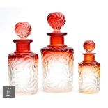 A graduated set of three late 19th Century Baccarat pressed glass cologne or scent bottles of