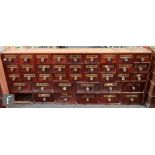 A 19th Century bank of thirty nine mahogany chemist drawers labelled G.ACACIAES, GBENZOIN, ALUM: