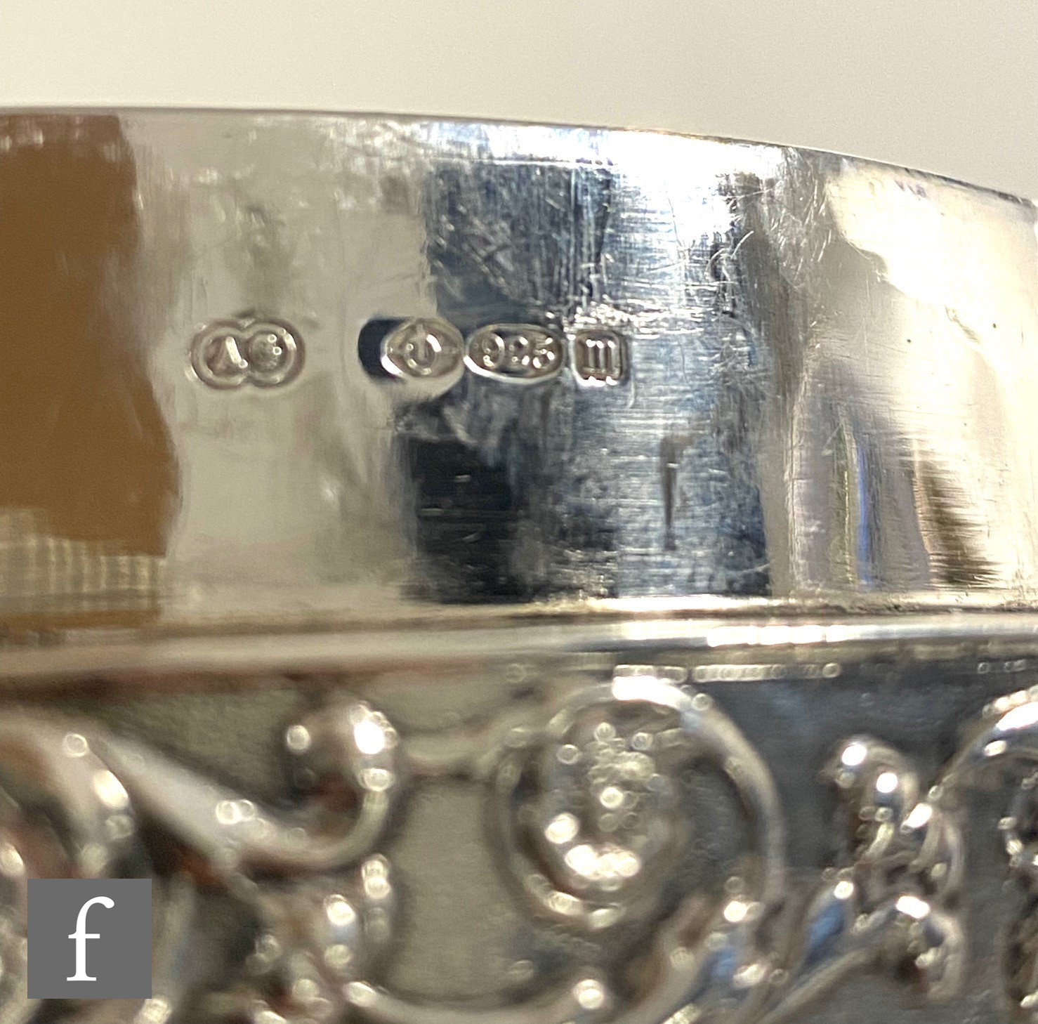 A hallmarked silver oval tea caddy with banded embossed foliate scroll decoration to body and pull - Image 3 of 5