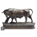 A 20th Century French patinated spelter study, after Charles Valton, modelled as a stylised bull