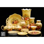A collection of assorted later 20th Century Aynsley Orchard Gold to include vases of varying form,