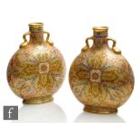 A pair of 19th Century Coalport moonflasks each decorated in a Persian repeat pattern with Paisley