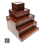 An early 20th Century mahogany five tier stand of cube and rectangular stepped form, height 46cm x