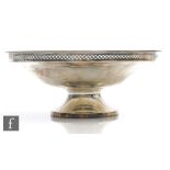 A hallmarked silver pedestal bowl of plain form terminating in pierced gallery, weight 9.5oz,