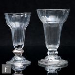 An early 18th Century jelly glass, fluted pan top bowl above a compressed knop raised to a domed,