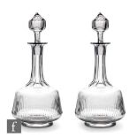 A pair of later 19th Century glass decanters, circa 1885, each of footed shouldered form with pillar