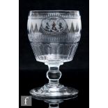 An early 19th Century glass rummer, circa 1800, the barrel bowl engraved with an oval cartouche