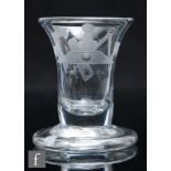 A late Georgian Masonic drinking glass, the trumpet bowl engraved with Masonic emblems, raised to