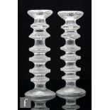 A pair of Iittala Festivo candlesticks by Timo Sarpaneva in clear crystal with textured six ring