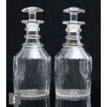 A pair of late Georgian clear crystal Regency cylinder decanters, circa 1810, basal slice cuts
