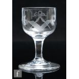 An early 19th Century Masonic wine glass, circa 1810, the cup bowl engraved with Masonic emblems,