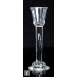An 18th Century Irish cordial glass, circa 1740, the funnel bowl  above a thick stem with an
