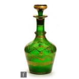A later 19th Century French glass decanter, circa 1870, the green body with Prussian shoulder