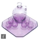 A 20th Century continental liquor set, comprising decanter of shouldered ovoid form with loop