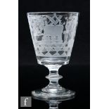 An early 19th Century Masonic glass rummer, circa 1810, the bucket bowl profusely engraved with