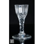 An 18th Century drinking glass, circa 1785, the slice cut ogee form bowl falling to a hollow diamond