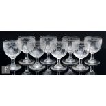 A set of eight 19th Century clear crystal drinking glasses, the ovoid bowl decorated with an oval