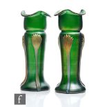 A pair of early 20th Century Kralik gold tri-claw glass vases with an iridescent green ground, circa