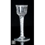 An 18th Century drinking glass, circa 1765, the ogee bowl with rim engraved with criss crossing