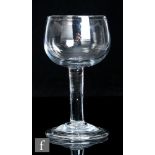An 18th Century mead glass, circa 1740, the cup bowl above a plain stem and conical folded foot,